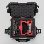 Top view of DJI Neo Black Color Adventure Ready Compact Waterproof Carry-on Case and Custom Foam Insert with a Red Layer, holding the DJI Neo Contoller and Batteries