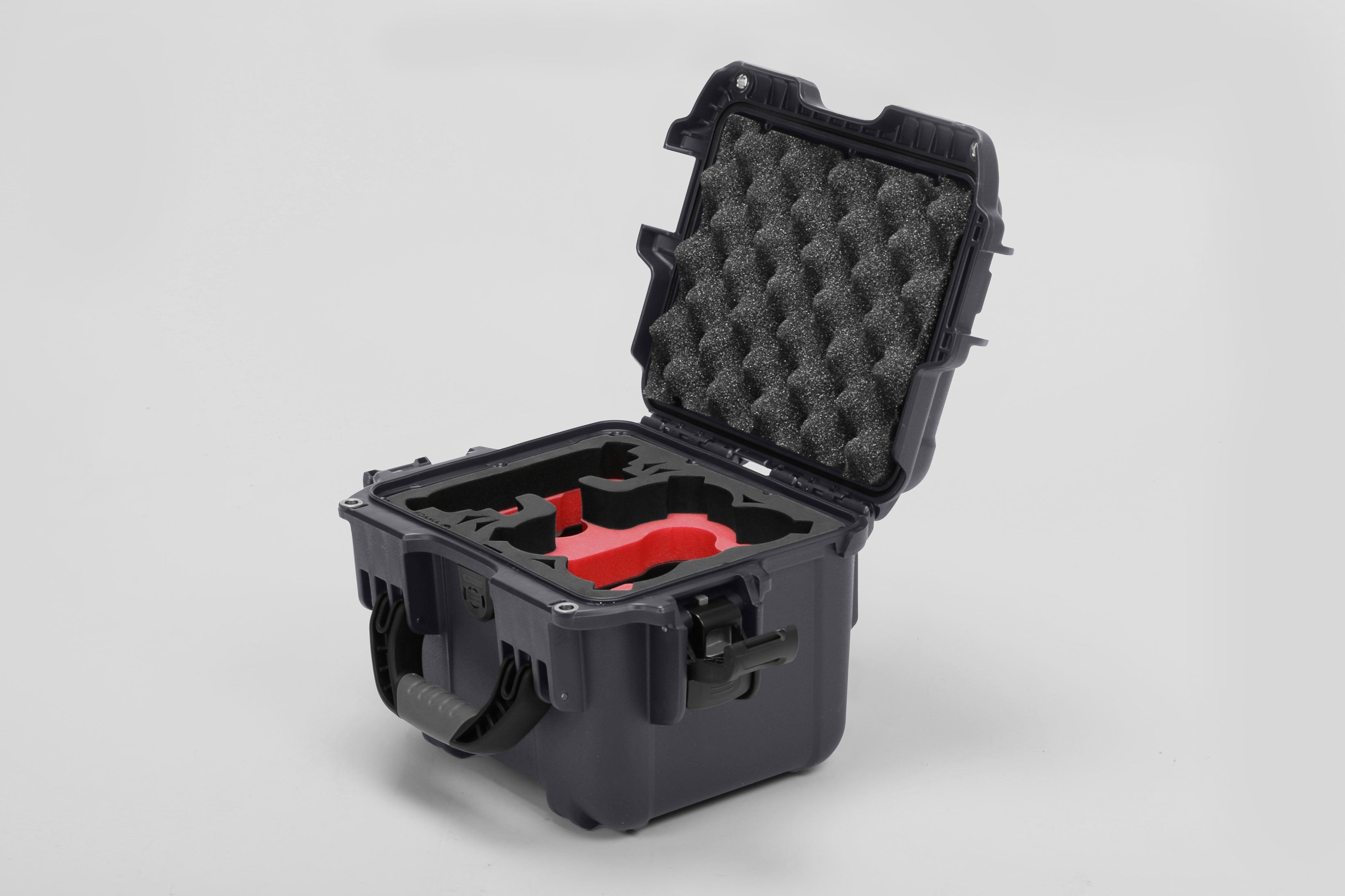 Angled view of DJI Neo Graphite Color Adventure Ready Compact Waterproof Carry-on Case and Custom Foam Insert with a Red Layer for DJI Neo