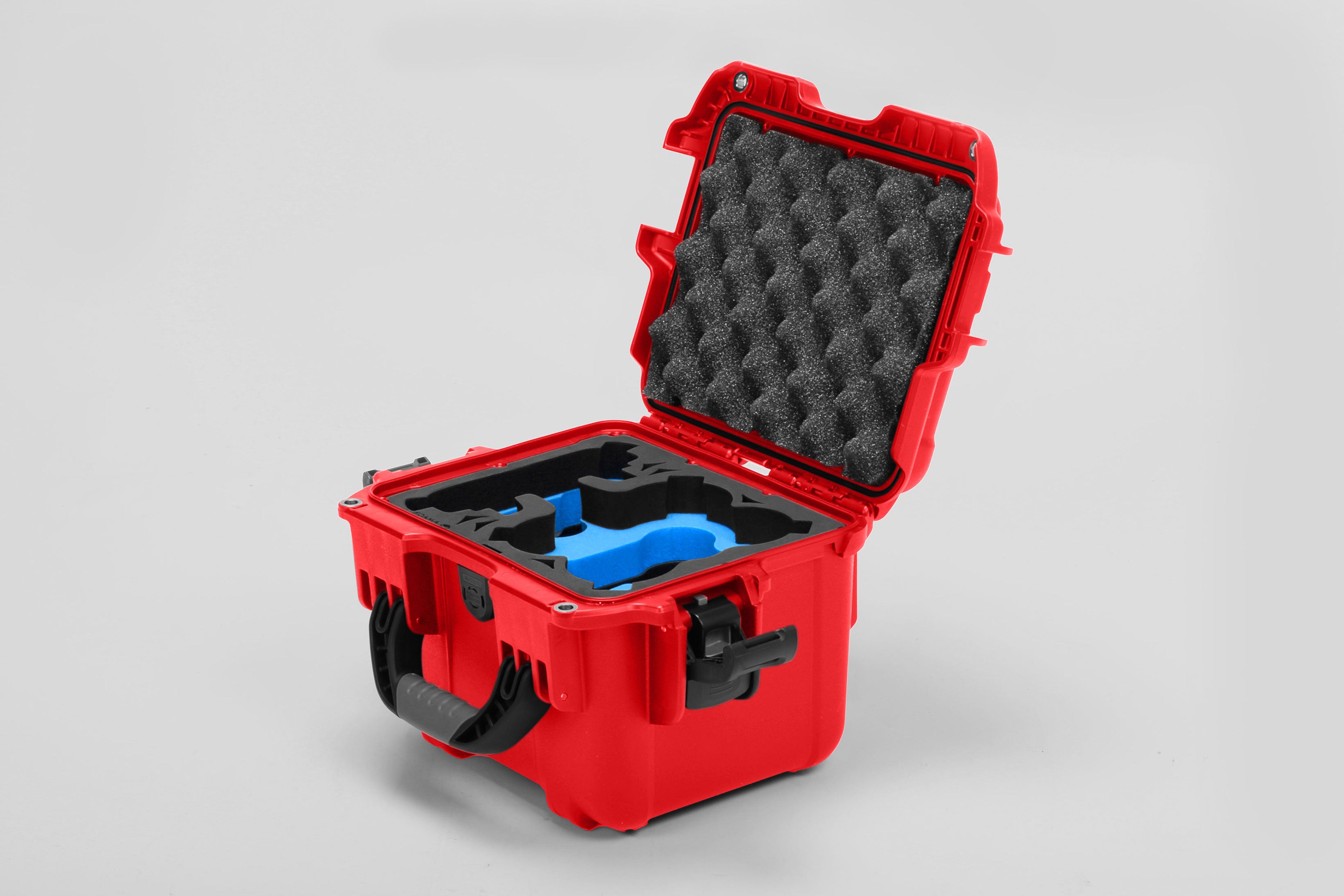 Angled view of DJI Neo Red Color Adventure Ready Compact Waterproof Carry-on Case and Custom Foam Insert with a Blue Layer for DJI Neo Fly More Combo