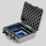 Angled view of Foama Silver Color All-Weather Carry-on Case and Custom Foam Insert with a Blue Layer for DJI Neo