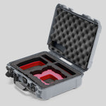 Angled view of Foama Silver Color All-Weather Carry-on Case and Custom Foam Insert with a Red Layer for DJI Neo