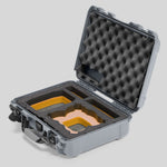 Angled view of Foama Silver Color All-Weather Carry-on Case and Custom Foam Insert with a Yellow Layer for DJI Neo