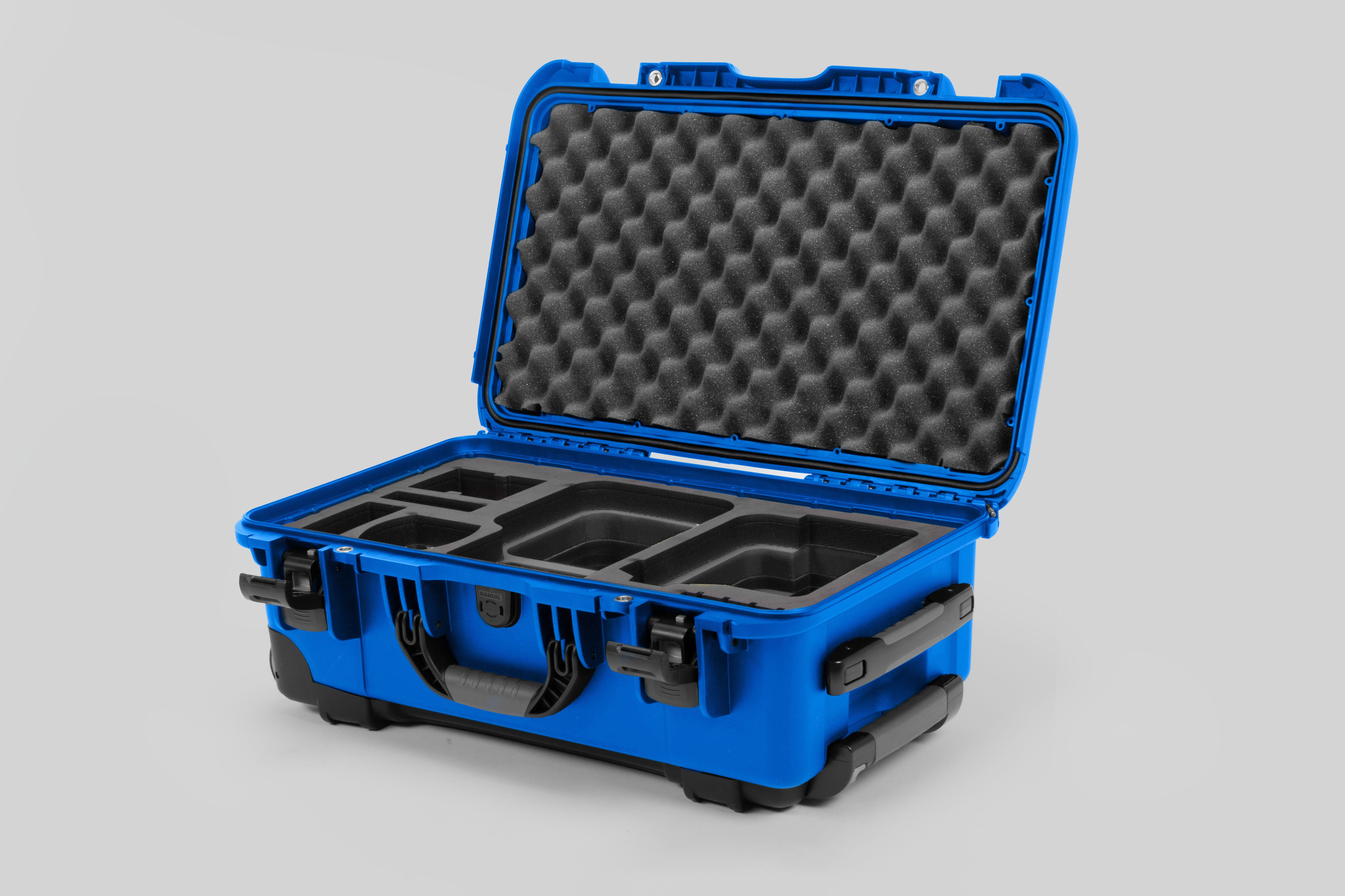 Angle view of Blue Color Canon C400 Camera Carry-on Case and Black Layer Custom Foam Insert