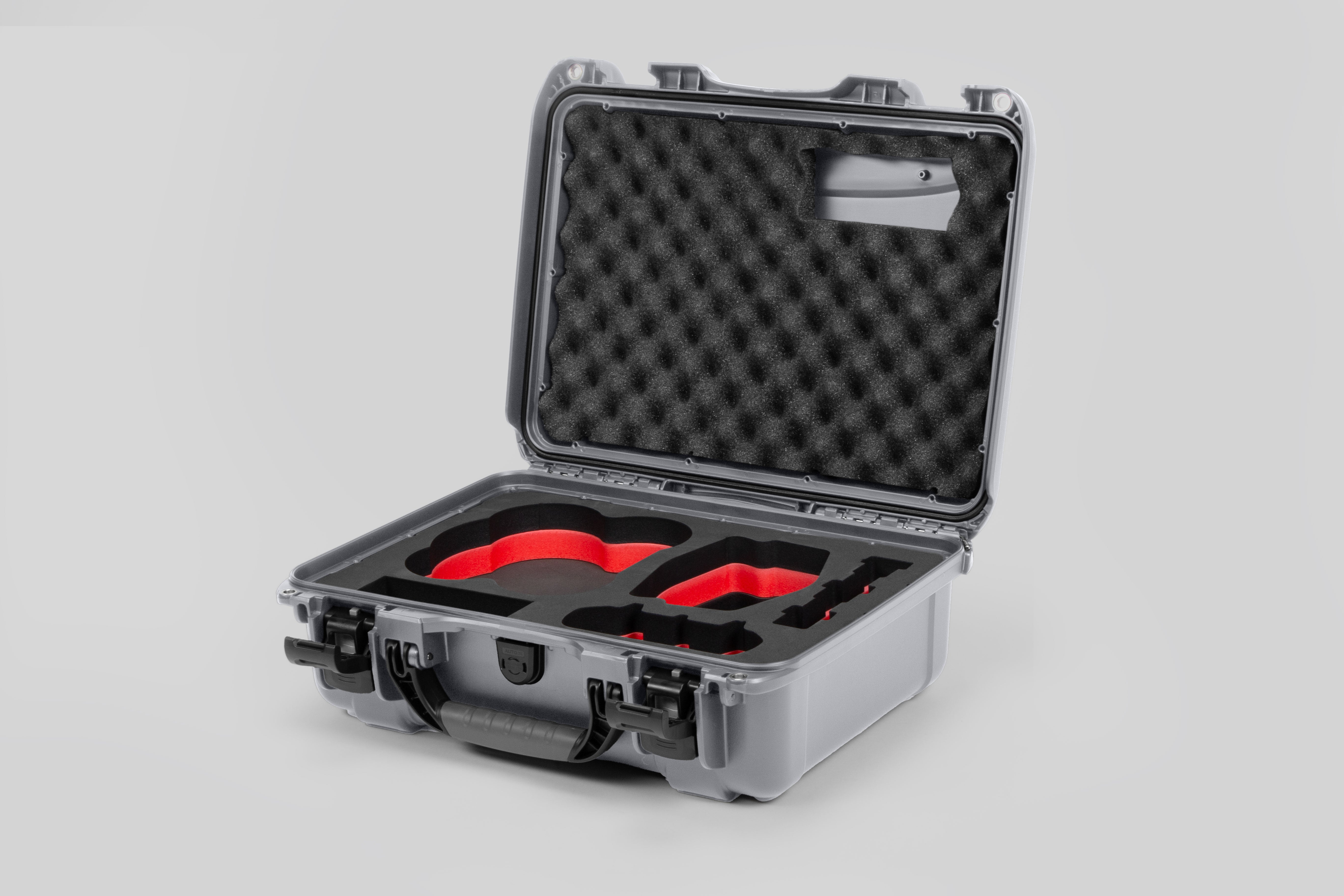 Angled view of DJI Avata 2 Fly More Combo Silver Color Waterproof Hard Case and Custom Foam Insert with a Red Layer