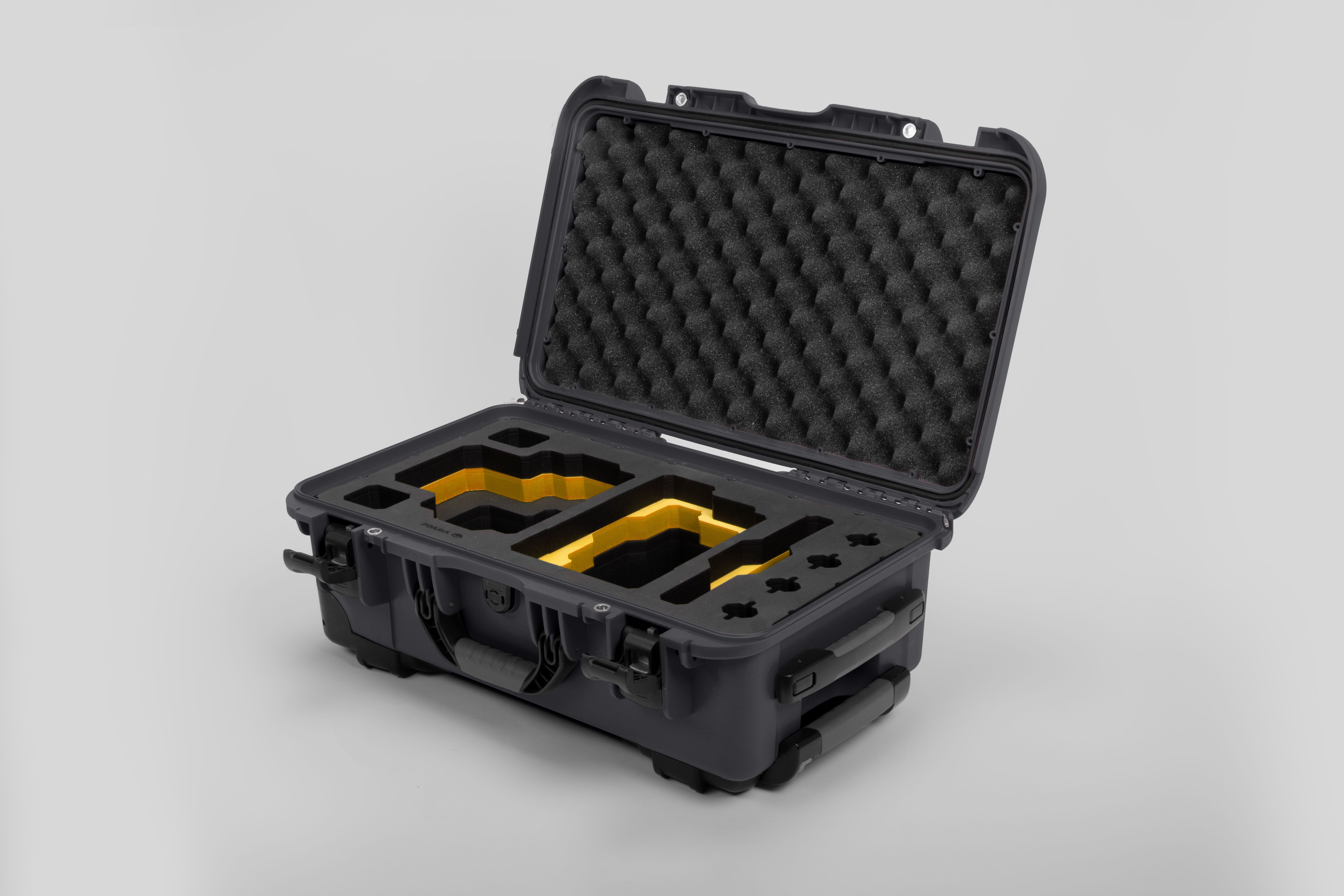 Angle view of Graphite Color RED V Raptor Carry-On Case with Yellow Layer Custom Foam Insert