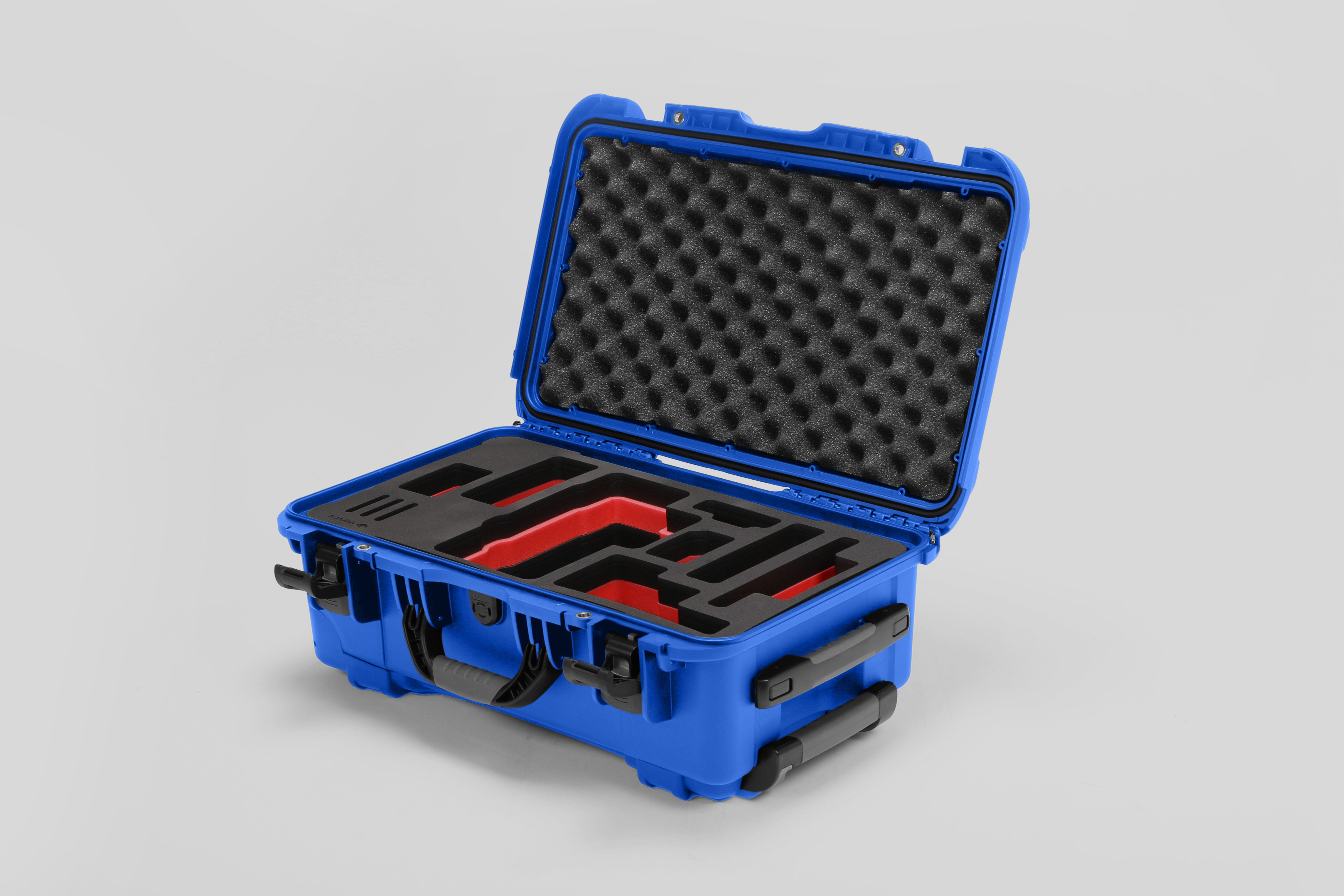 Angled view of Foama Blue Color Travel Case and Custom Foam Insert with Red Layer for RED Monstro