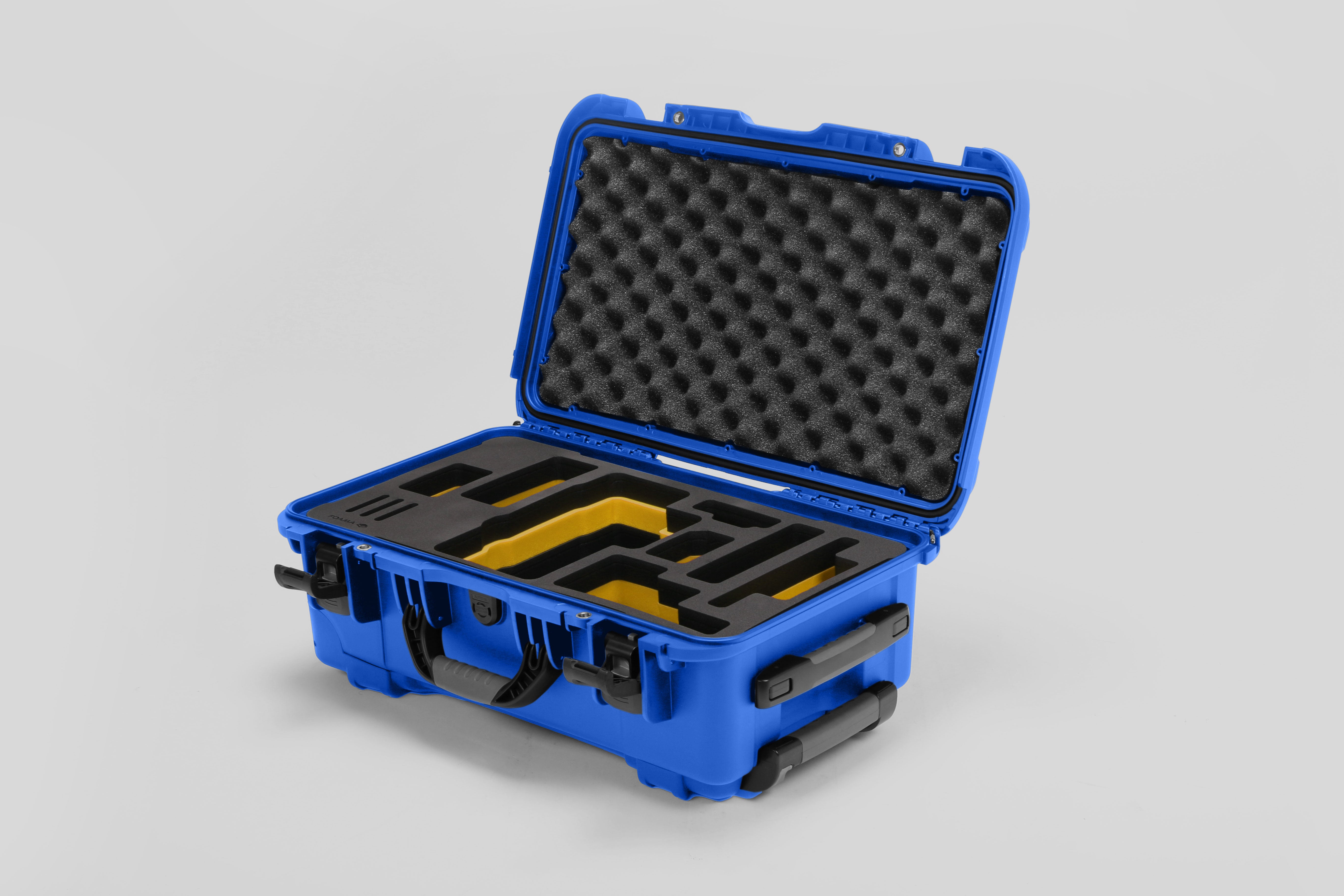 Angled view of Foama Blue Color Travel Case and Custom Foam Insert with Yellow Layer for RED Monstro