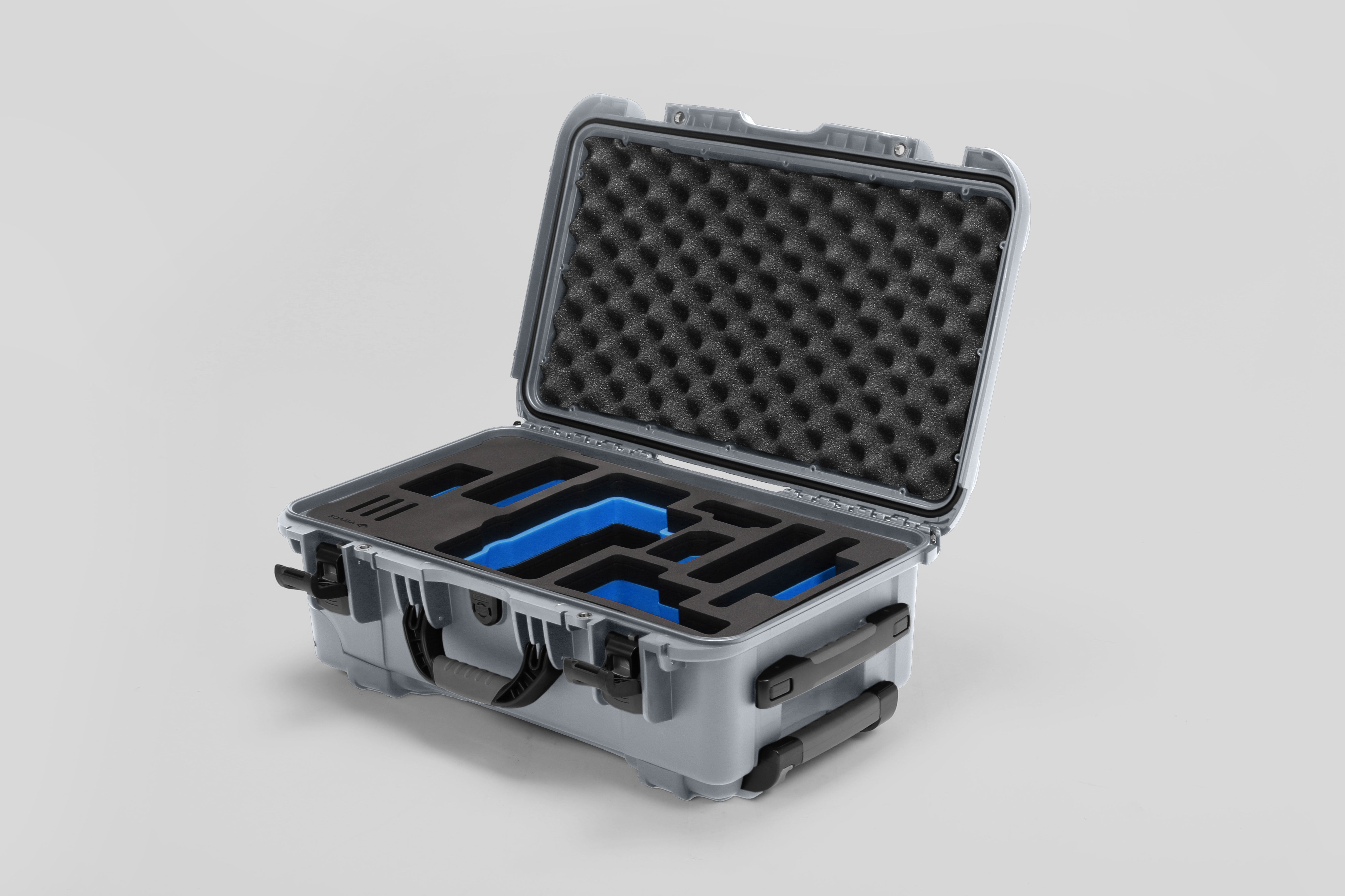 Angled view of Foama Silver Color Travel Case and Custom Foam Insert with Blue Layer for RED Monstro