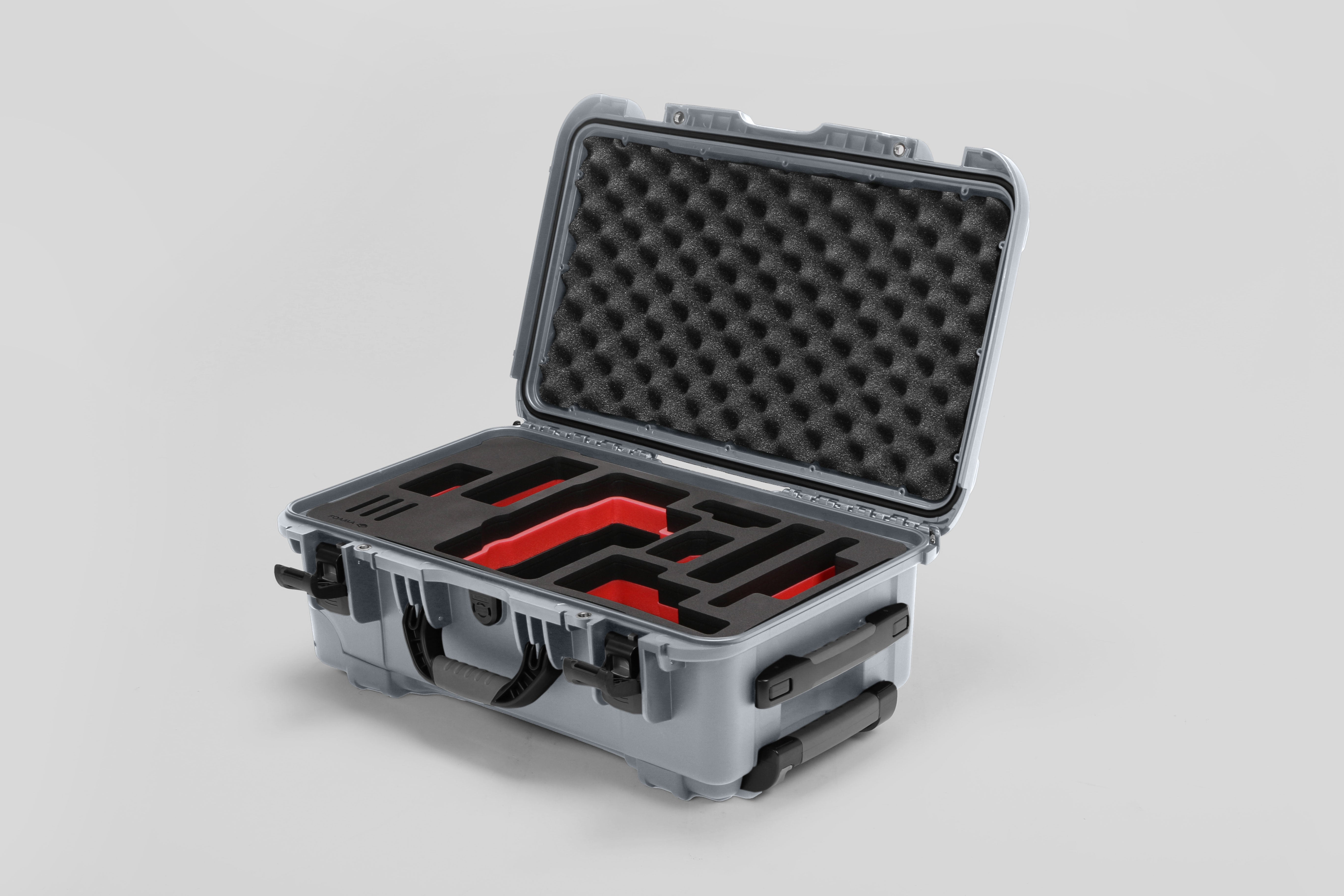 Angled view of Foama Silver Color Travel Case and Custom Foam Insert with Red Layer for RED Monstro