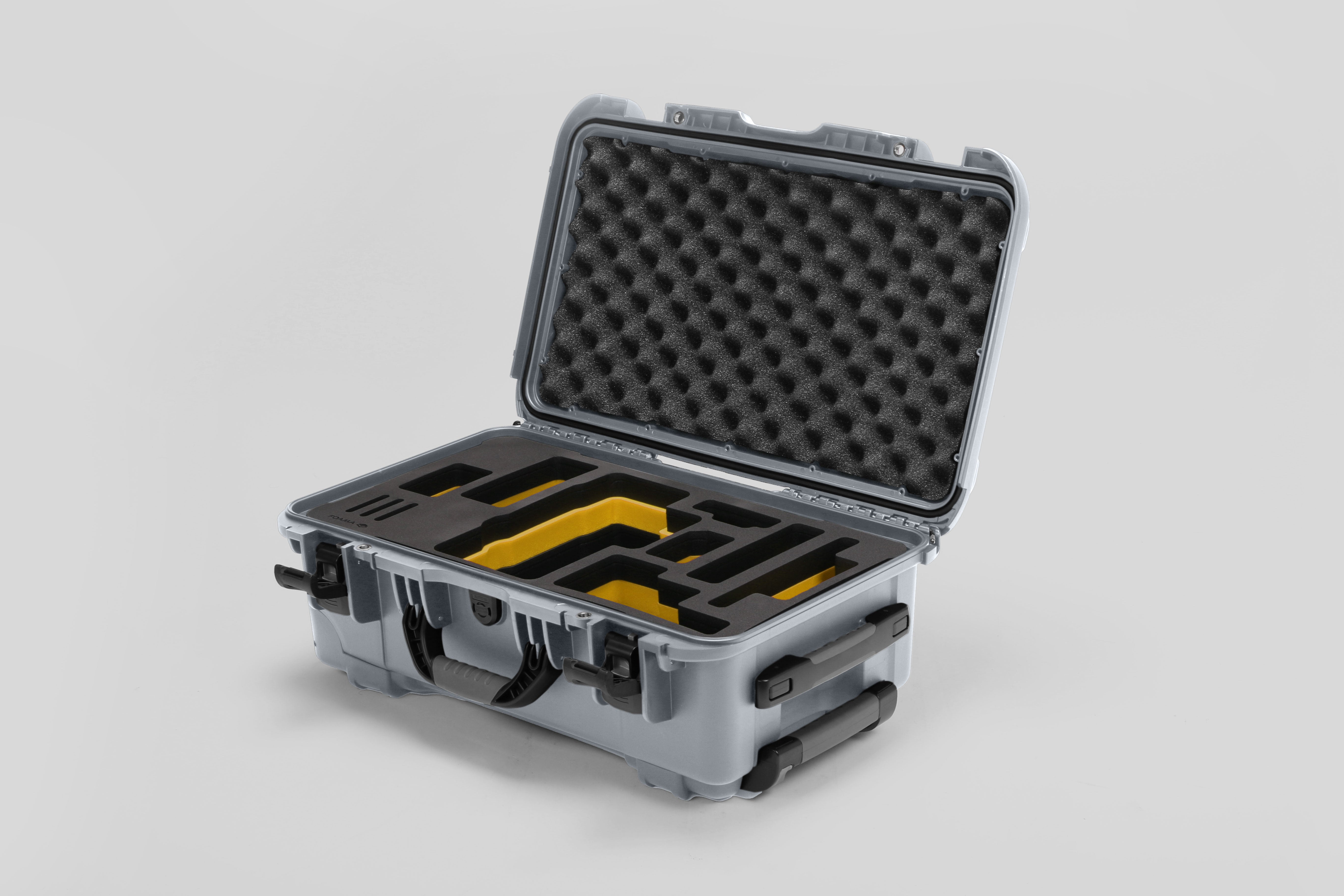 Angled view of Foama Silver Color Travel Case and Custom Foam Insert with Yellow Layer for RED Monstro