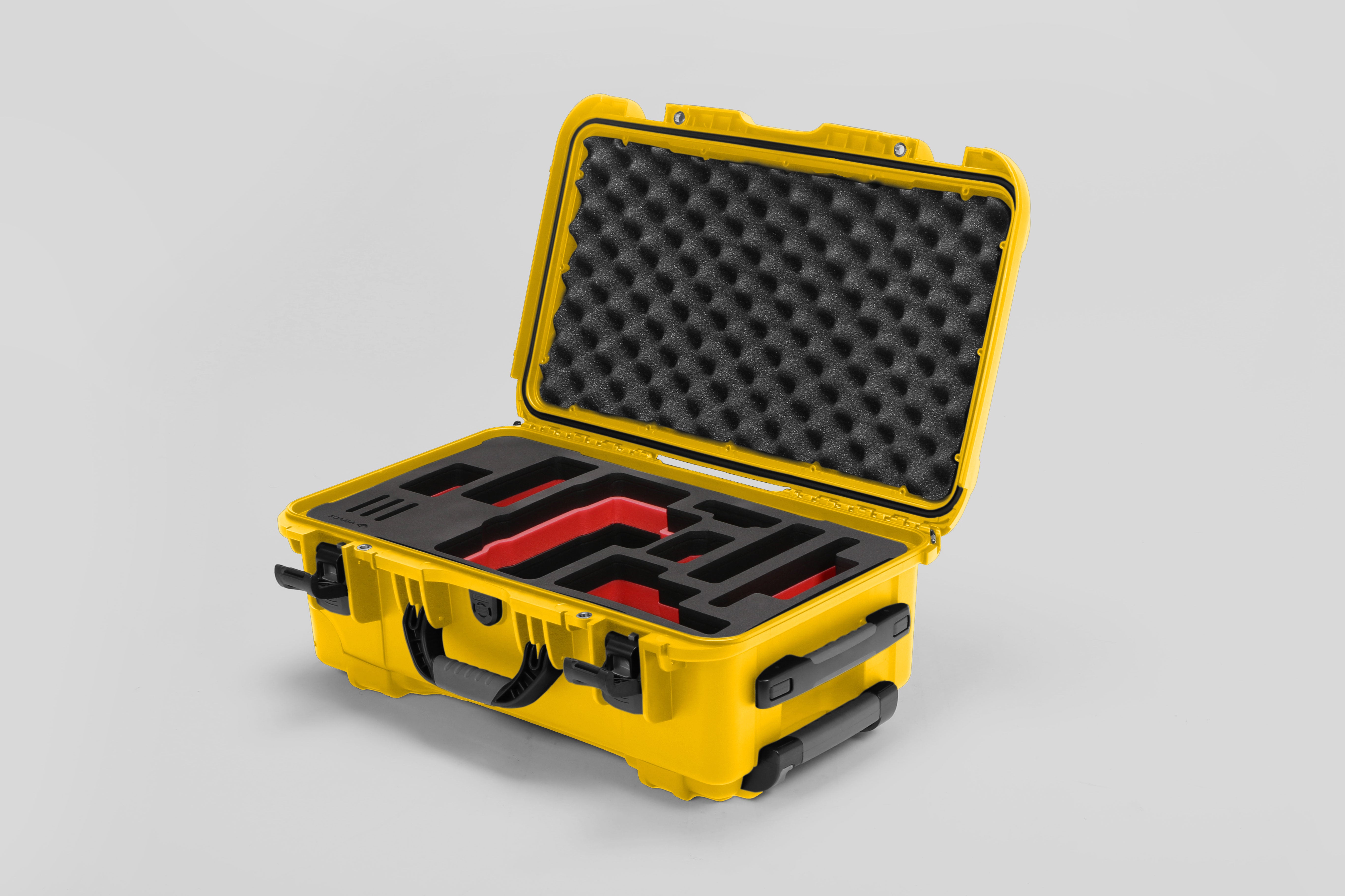 Angled view of Foama Yellow Color Travel Case and Custom Foam Insert with Red Layer for RED Monstro
