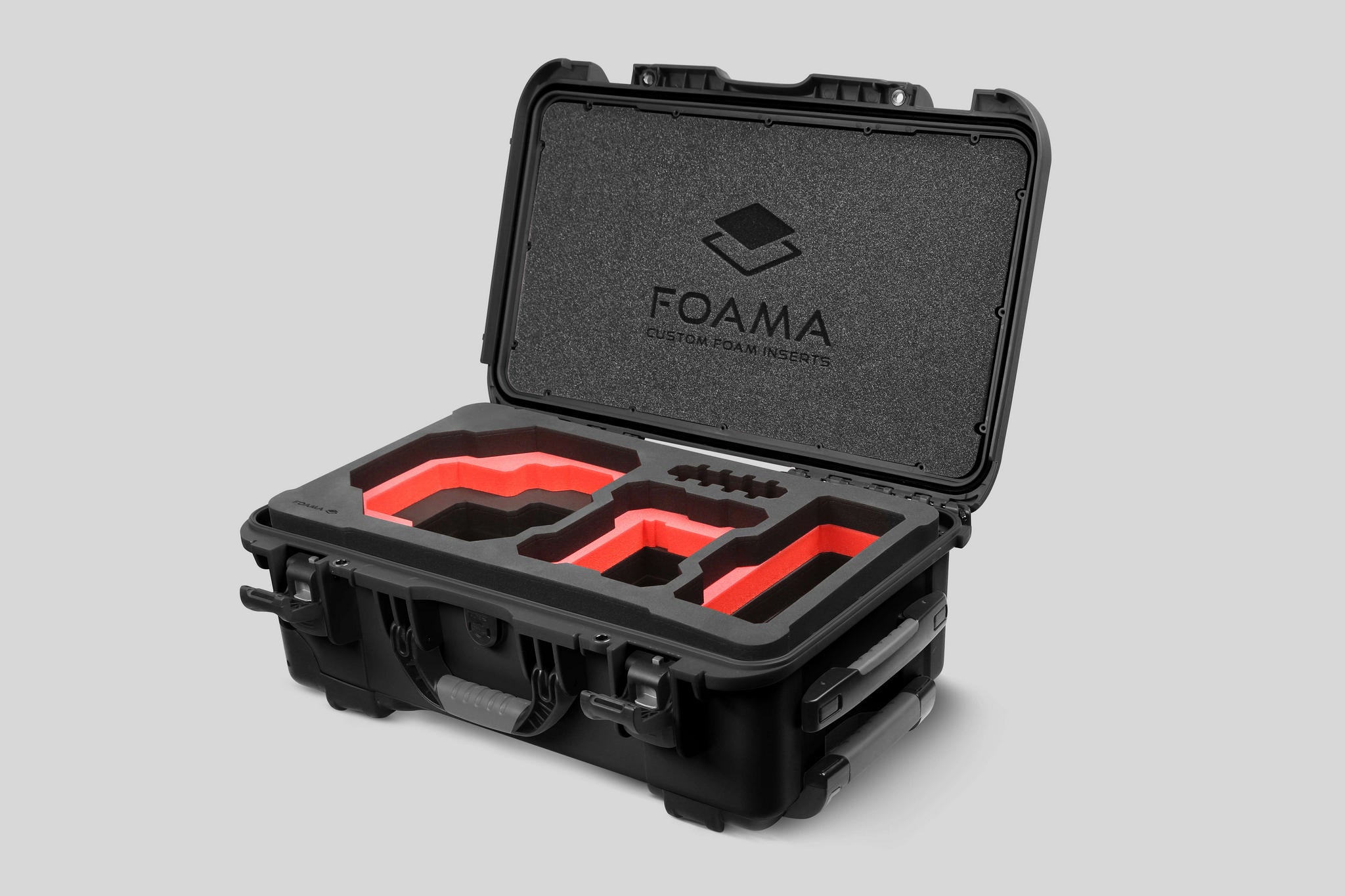 Angled view of Foama Black Color Carry-on case and Custom Foam Insert with Red Layer for RED Komodo-X