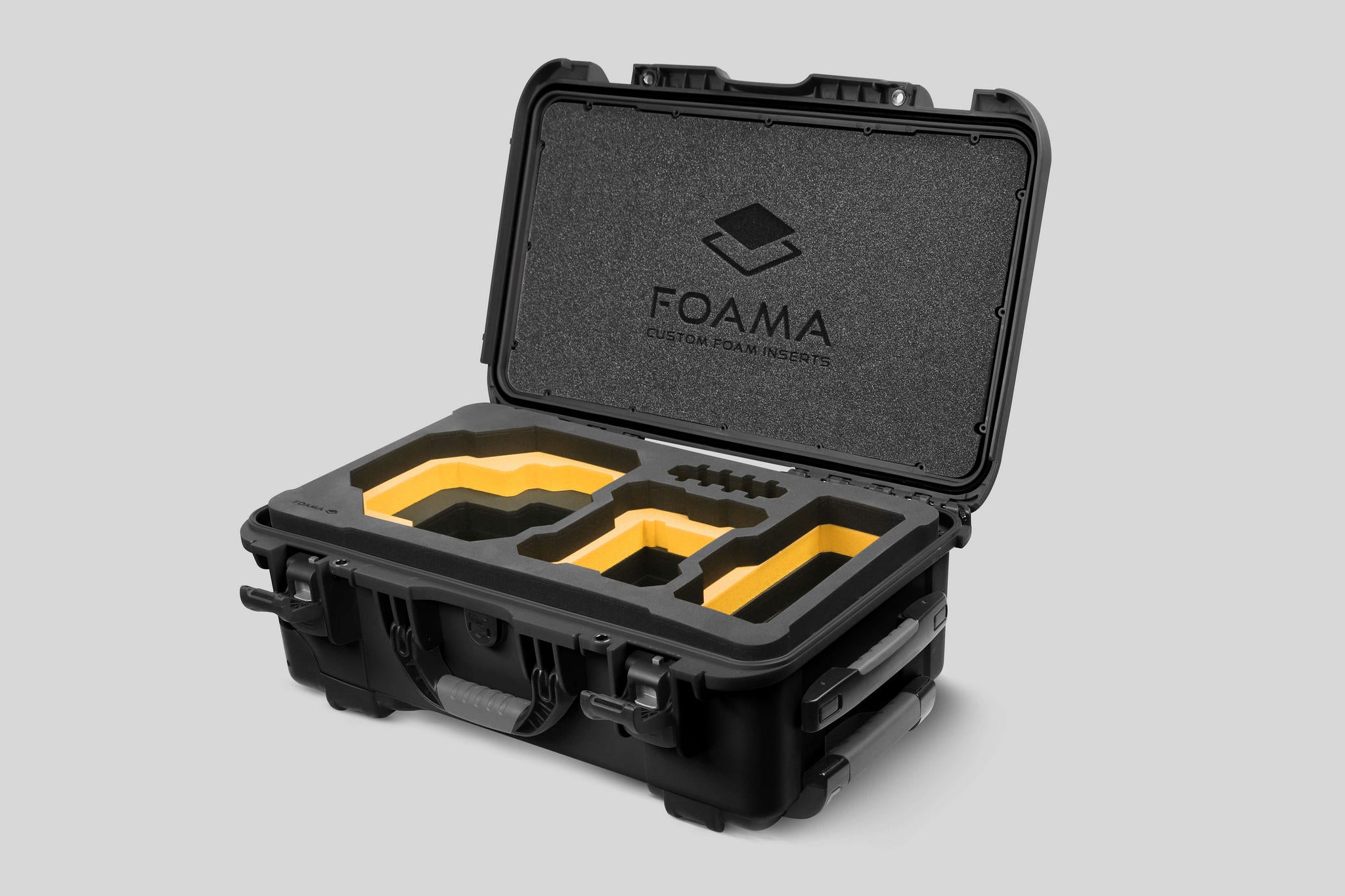 Angled view of Foama Black Color Carry-on case and Custom Foam Insert with Yellow Layer for RED Komodo-X