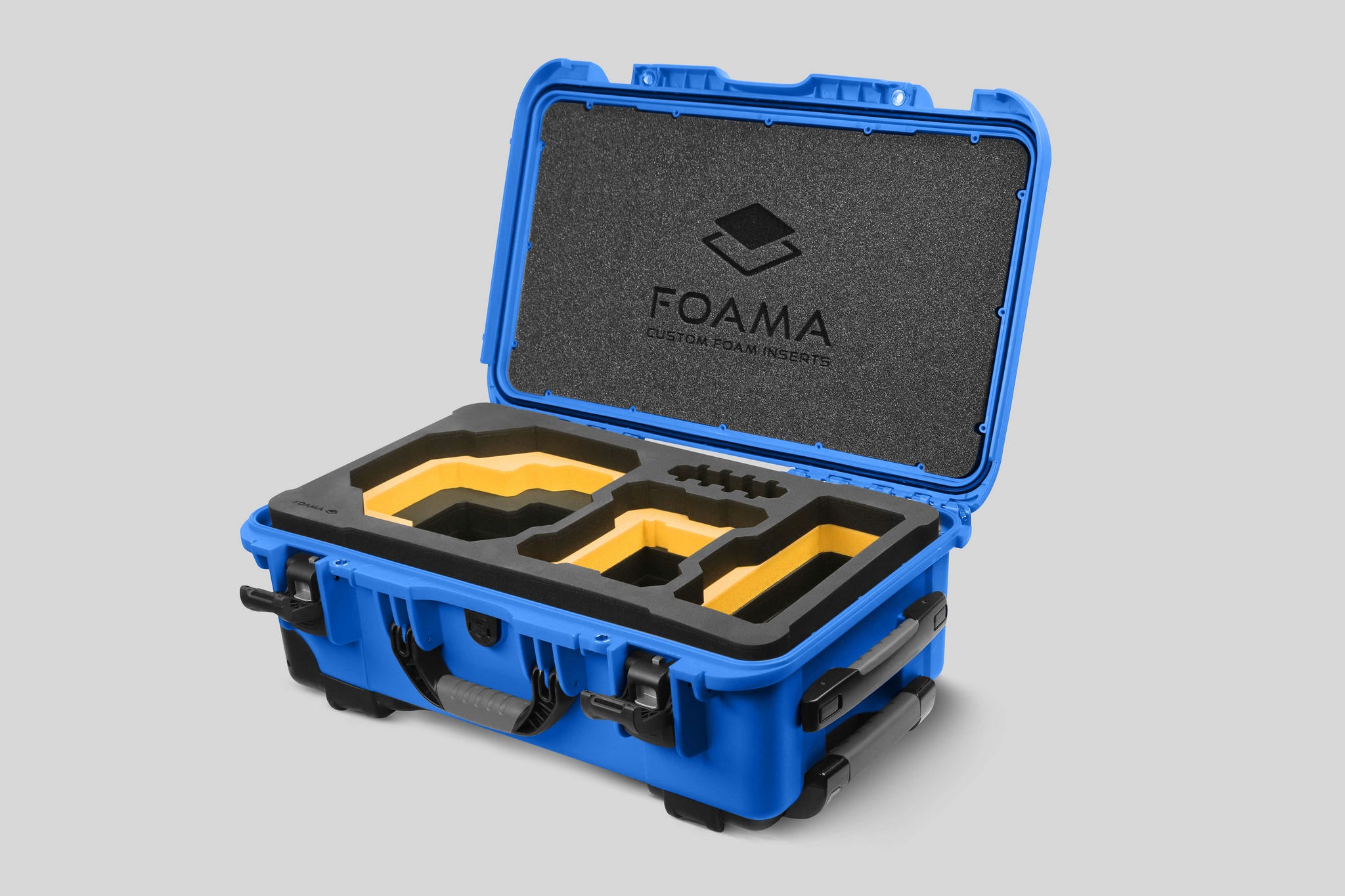 Angled view of Foama Blue Color Carry-on case and Custom Foam Insert with Yellow Layer for RED Komodo-X