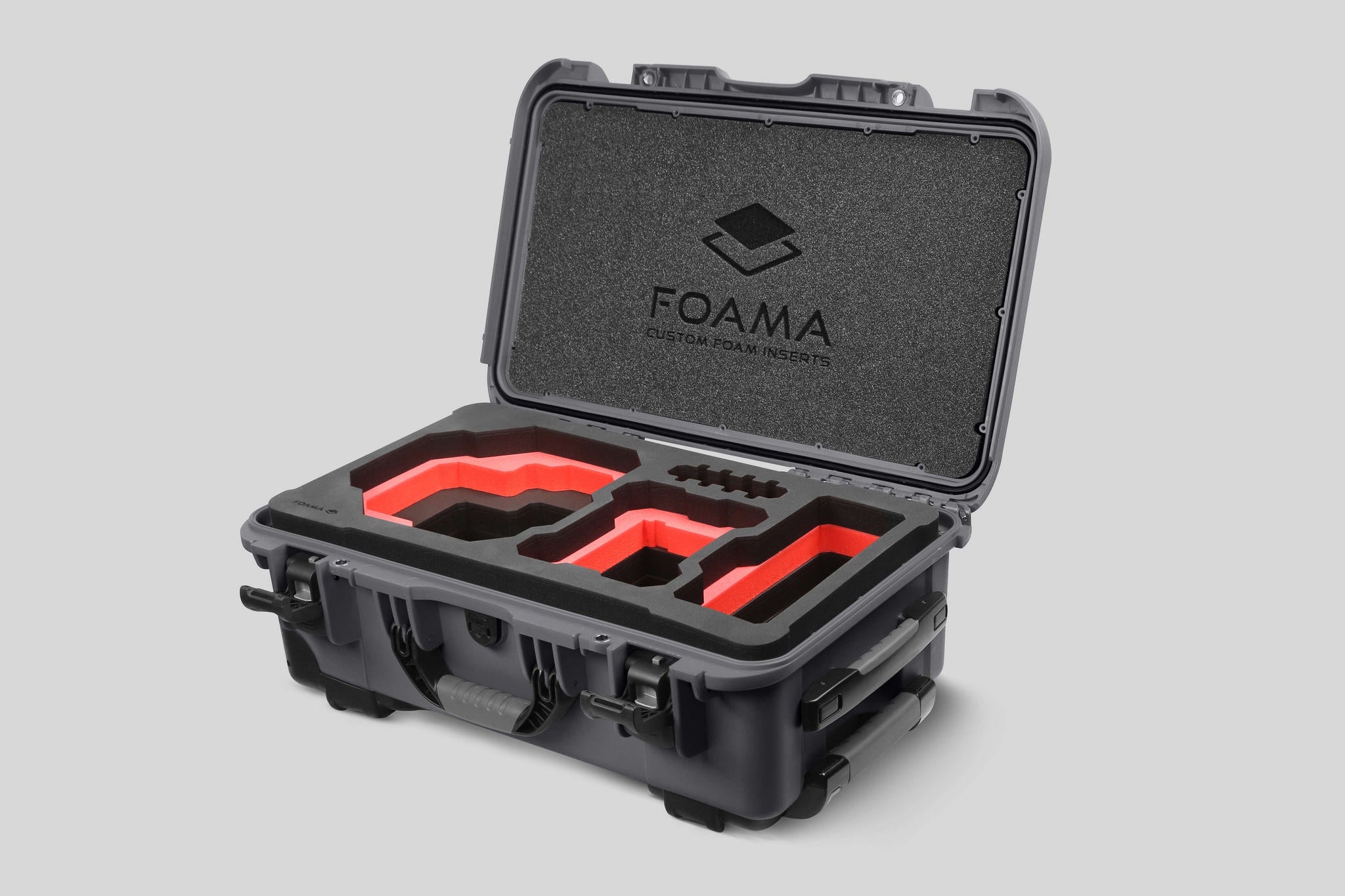 Angled view of Foama Graphite Color Carry-on case and Custom Foam Insert with Red Layer for RED Komodo-X