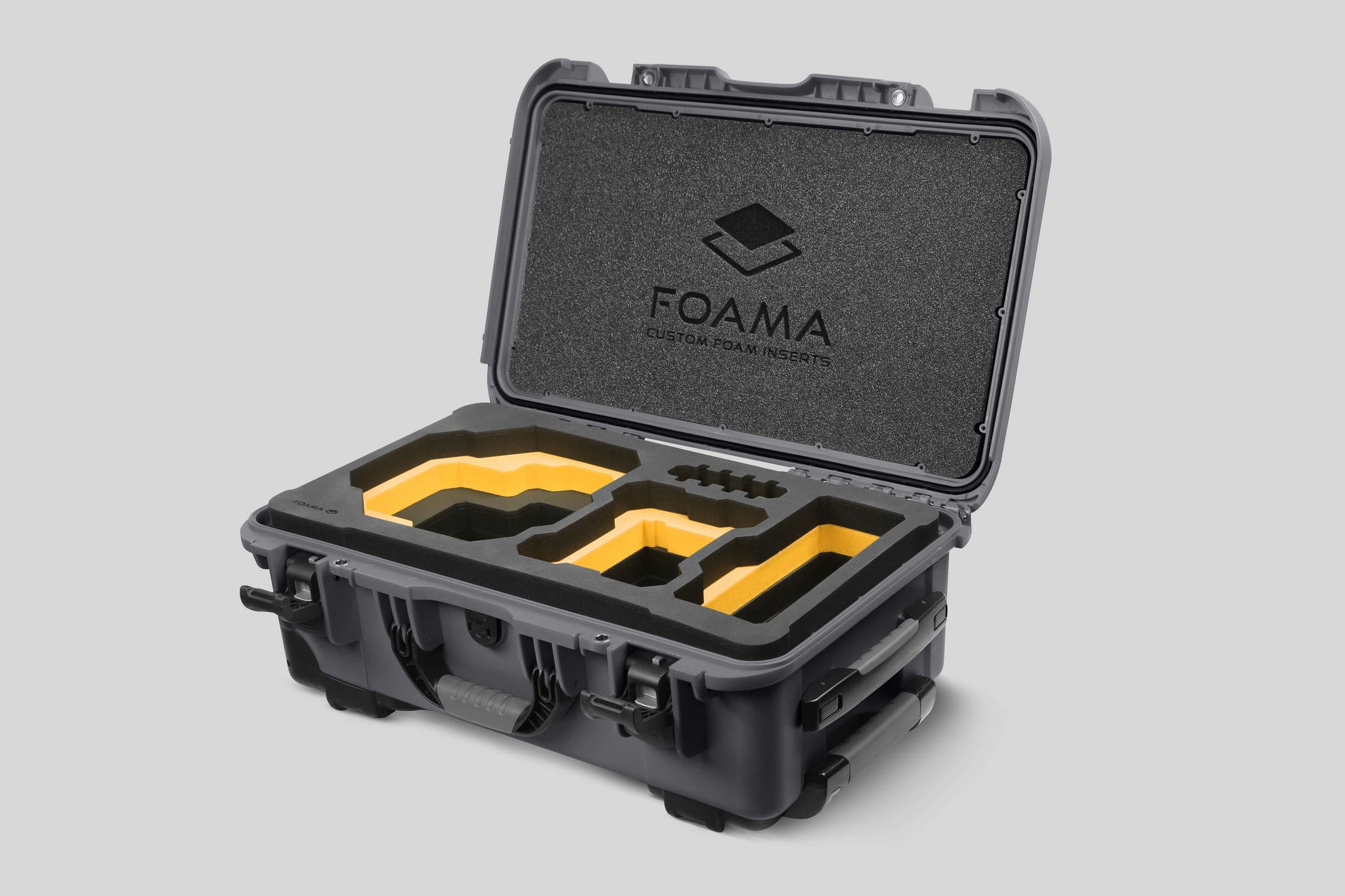 Angled view of Foama Graphite Color Carry-on case and Custom Foam Insert with Yellow Layer for RED Komodo-X