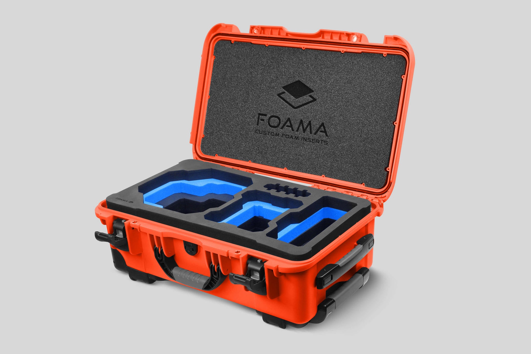 Angled view of Foama Orange Color Carry-on case and Custom Foam Insert with Blue Layer for RED Komodo-X