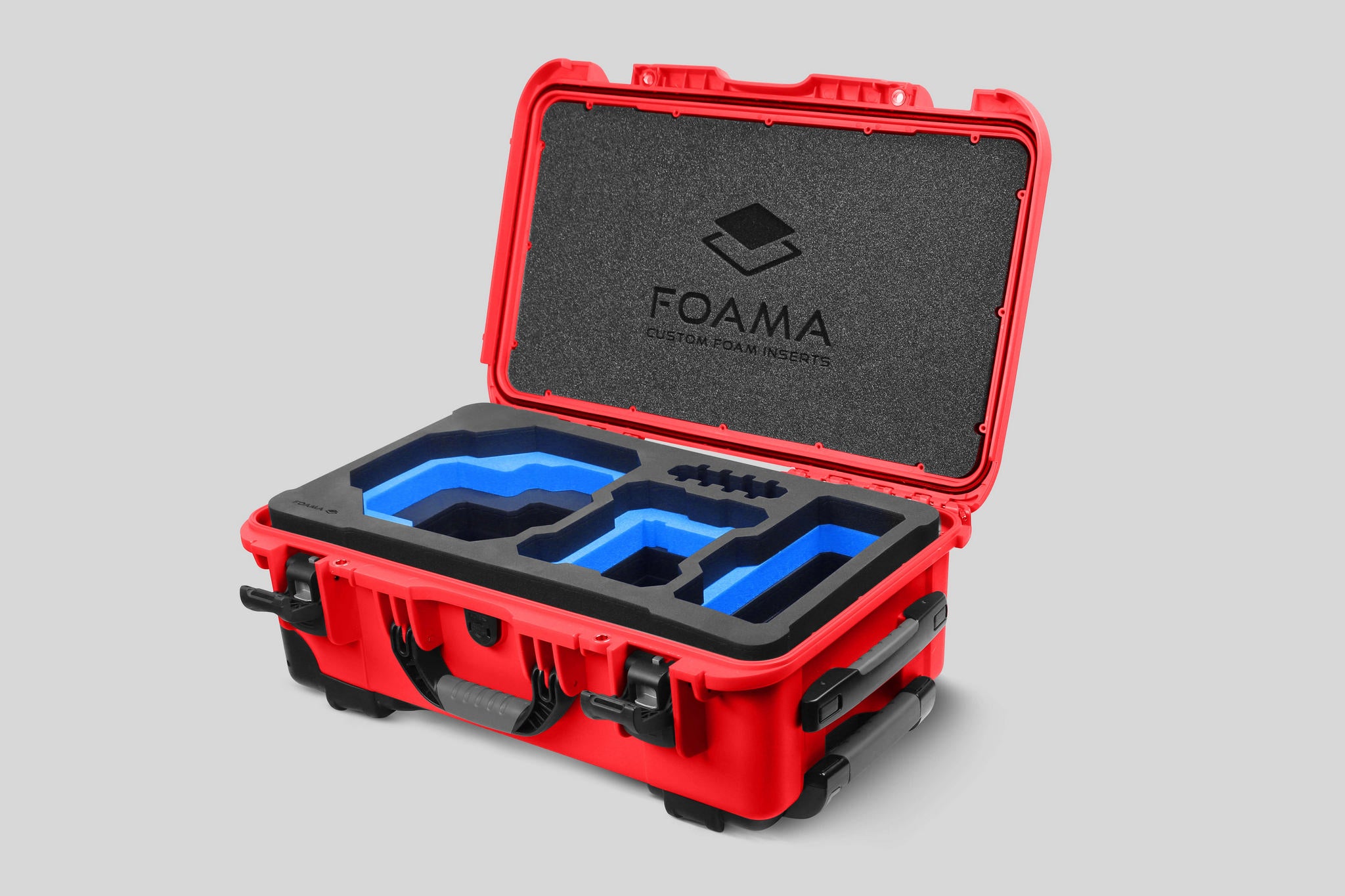 Angled view of Foama Red Color Carry-on case and Custom Foam Insert with Blue Layer for RED Komodo-X