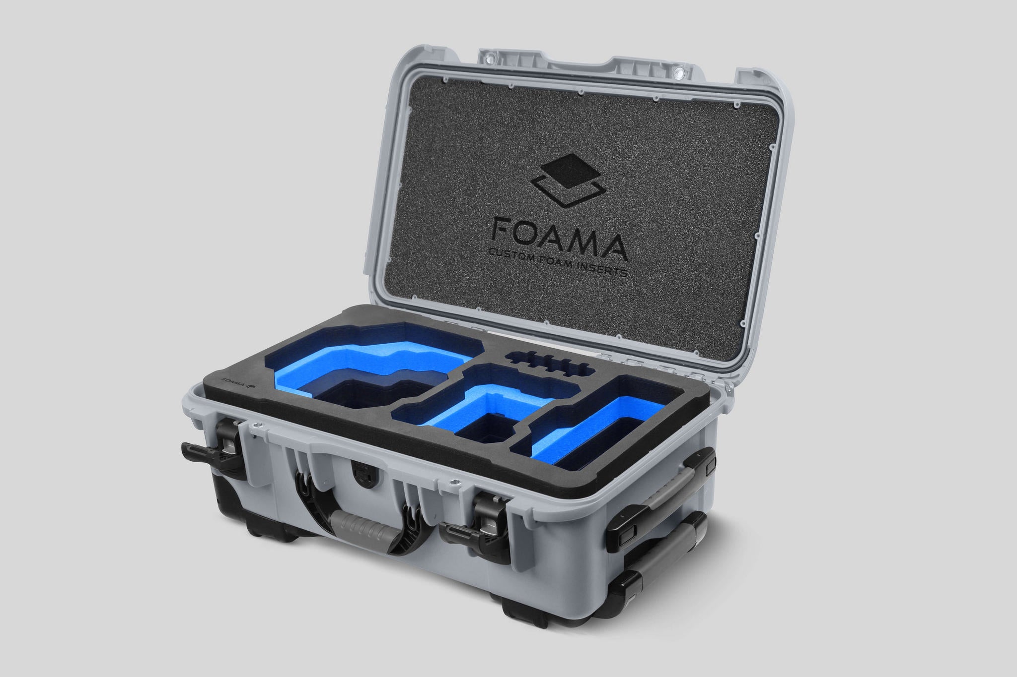 Angled view of Foama Silver Color Carry-on case and Custom Foam Insert with Blue Layer for RED Komodo-X