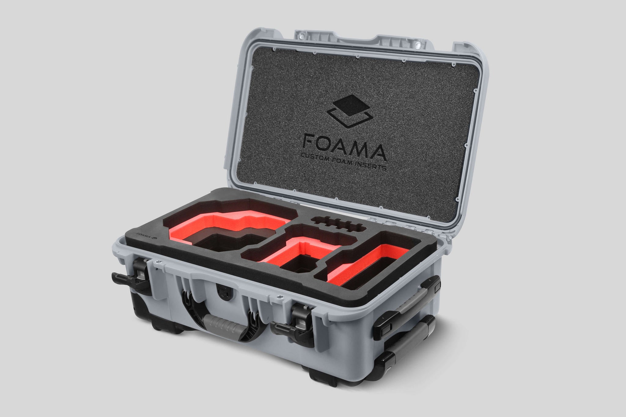 Angled view of Foama Silver Color Carry-on case and Custom Foam Insert with Red Layer for RED Komodo-X