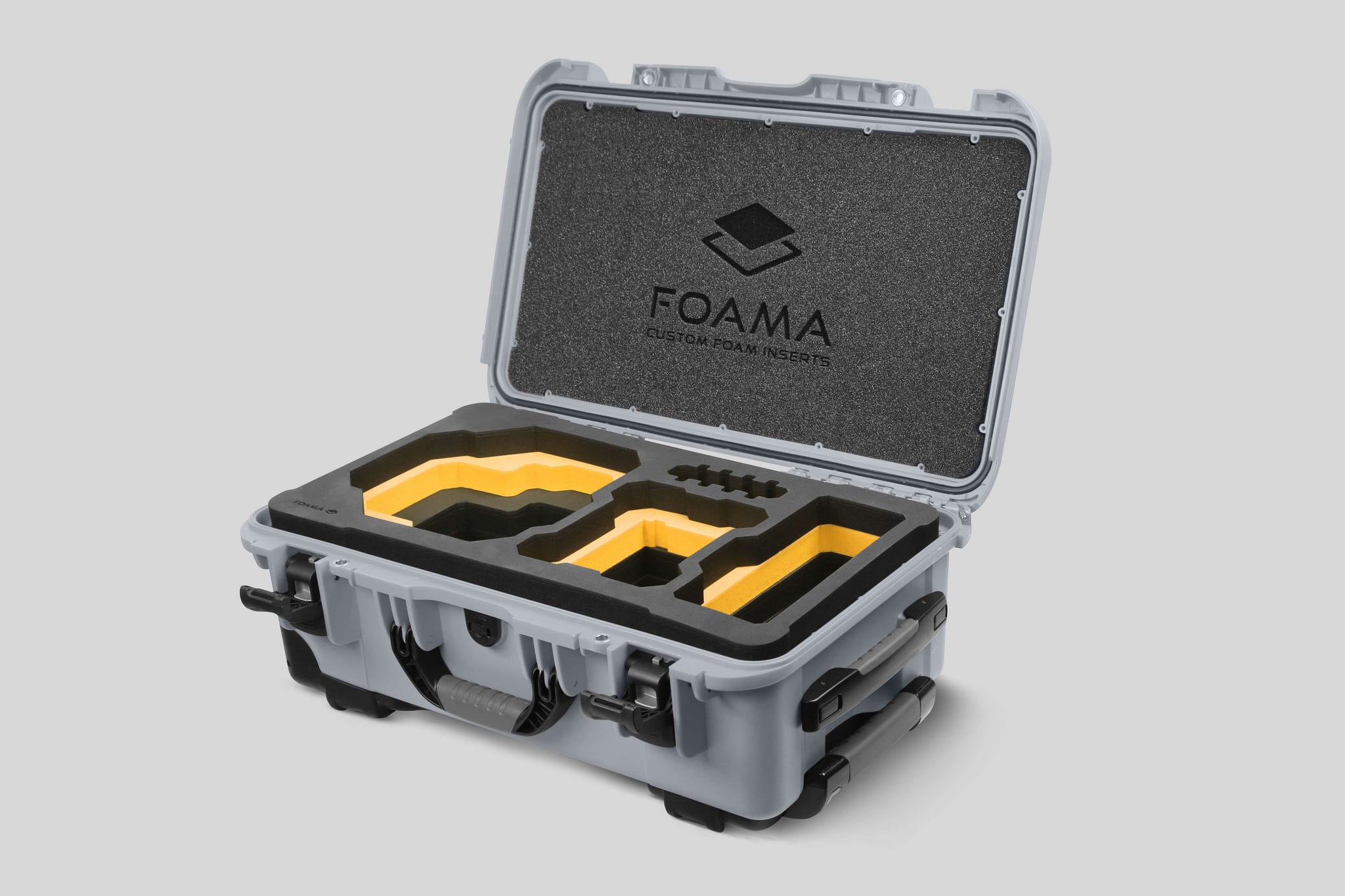 Angled view of Foama Silver Color Carry-on case and Custom Foam Insert with Yellow Layer for RED Komodo-X