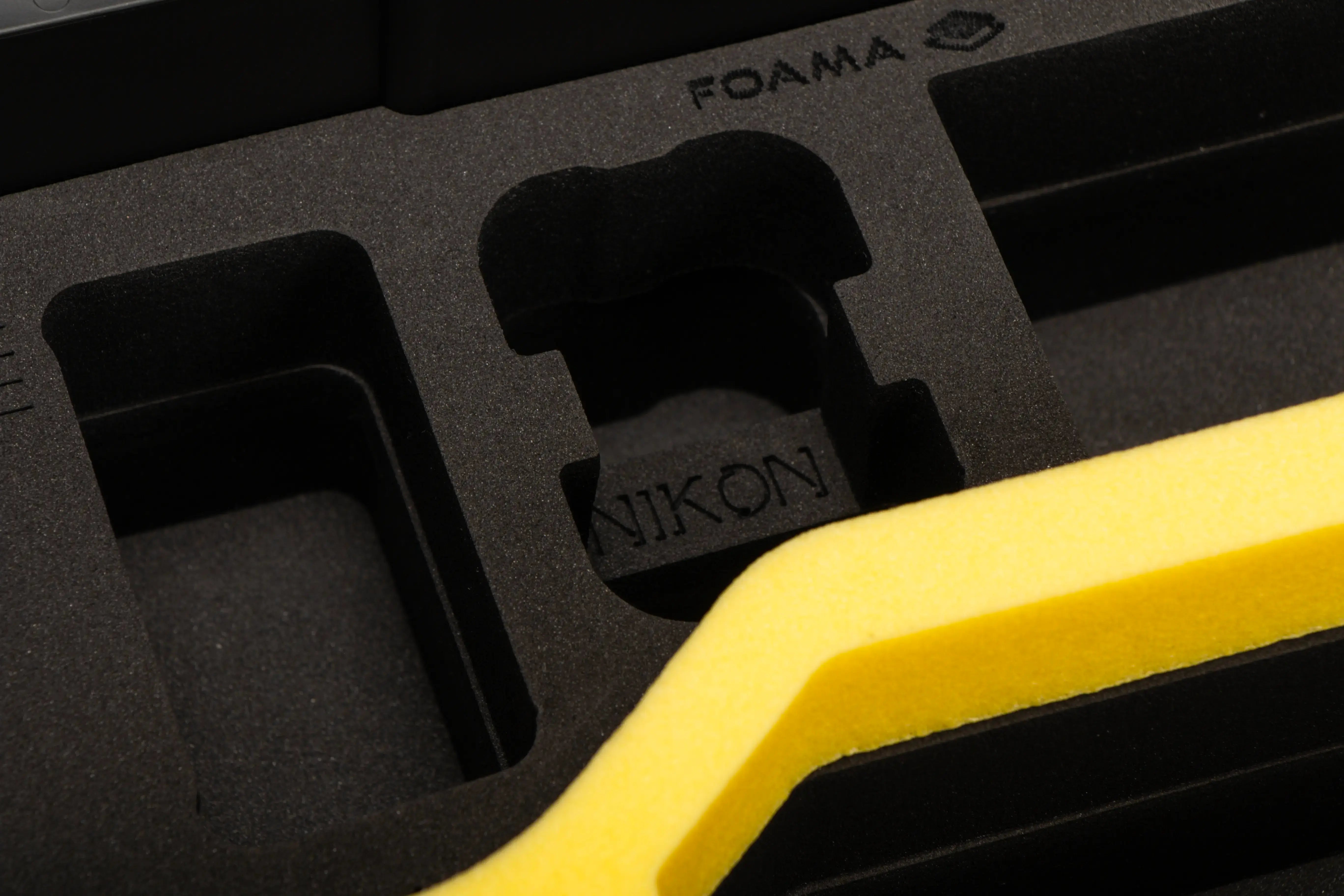 Close view of Black Nikon Compact Camera Case for Z8, Z7 lI, Z6 lI, Z6 III with Yellow Layer Custom Foam Insert