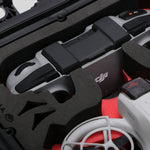 Close-up view 2 of DJI Neo Black Color Adventure Ready Compact Waterproof Carry-on Case and Custom Foam Insert with a Red Layer, holding the DJI Neo Combo