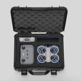 Top view of Foama black all-weather carry-on case with stylish blue layer insert, holding DJI Neo