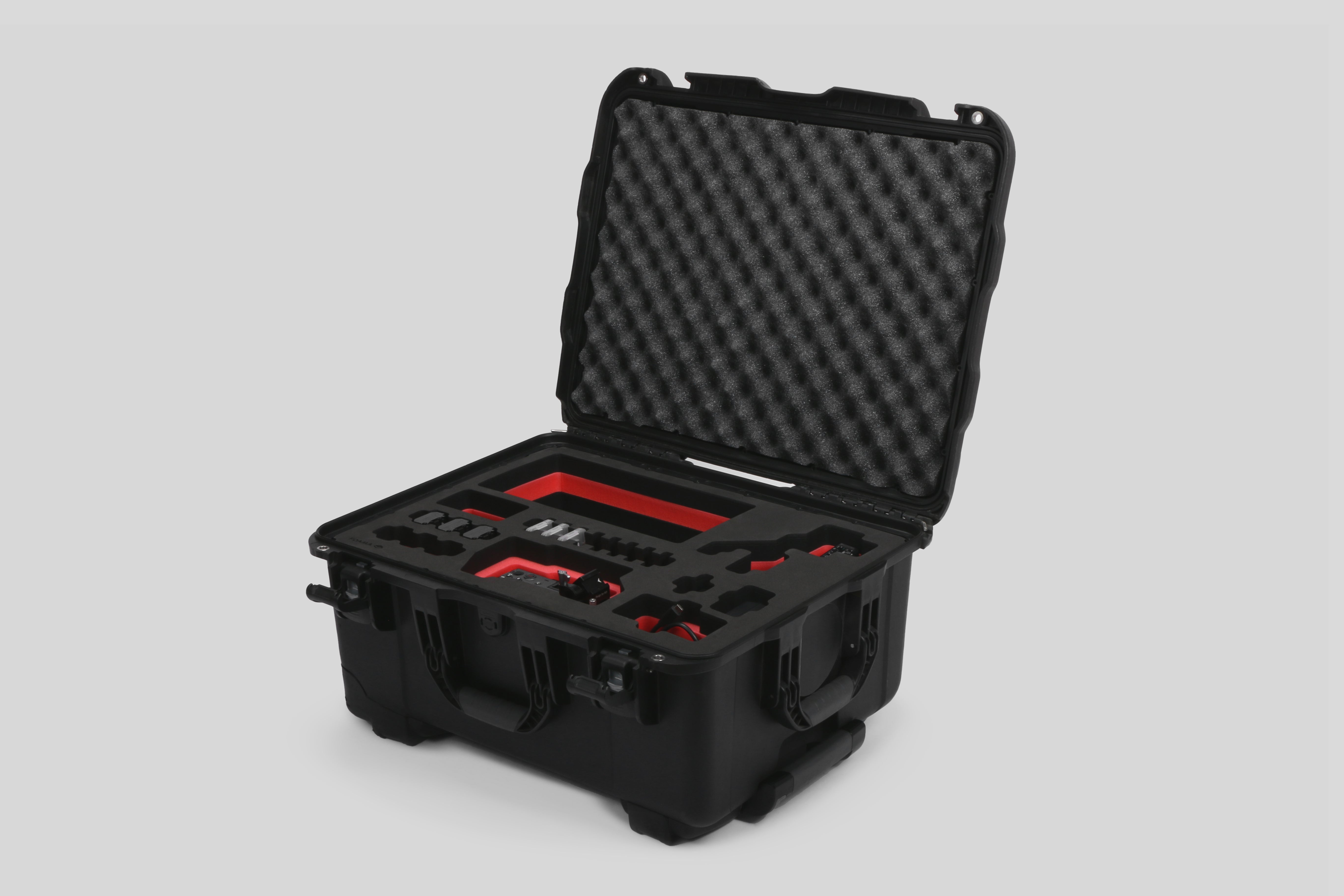 Angled view of Sony FX3 and accessories in Black Color Studio Case and Custom Foam Insert with a red layer