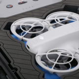 Close up view 1 of Foama black all-weather carry-on case with stylish blue layer insert, holding DJI Neo