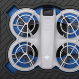 Close up view 2 of Foama black all-weather carry-on case with stylish blue layer insert, holding DJI Neo